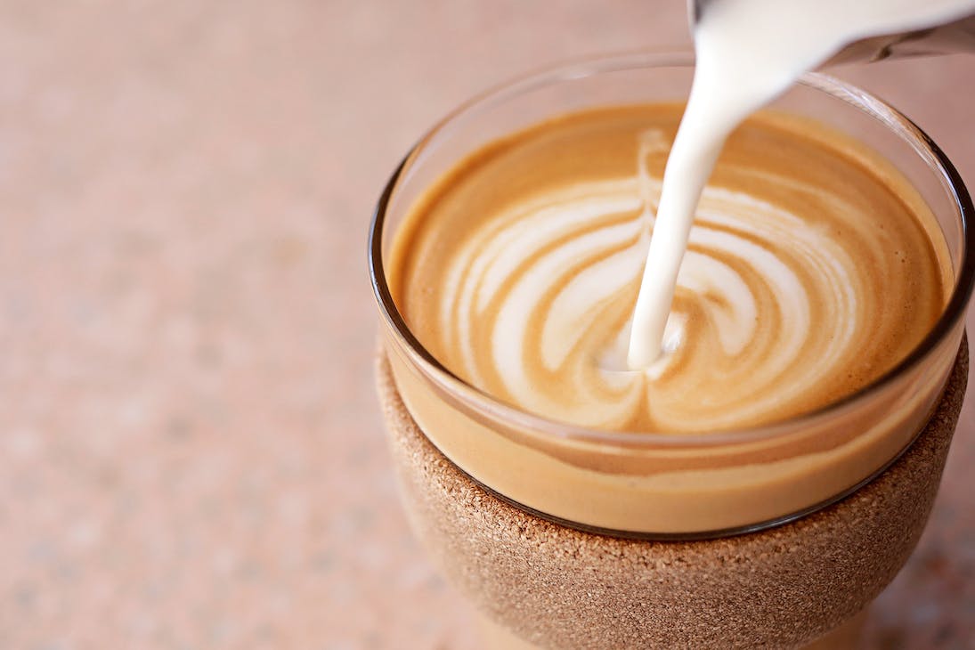 a coffee being poured at a cafe open on January 26 public holiday in Perth